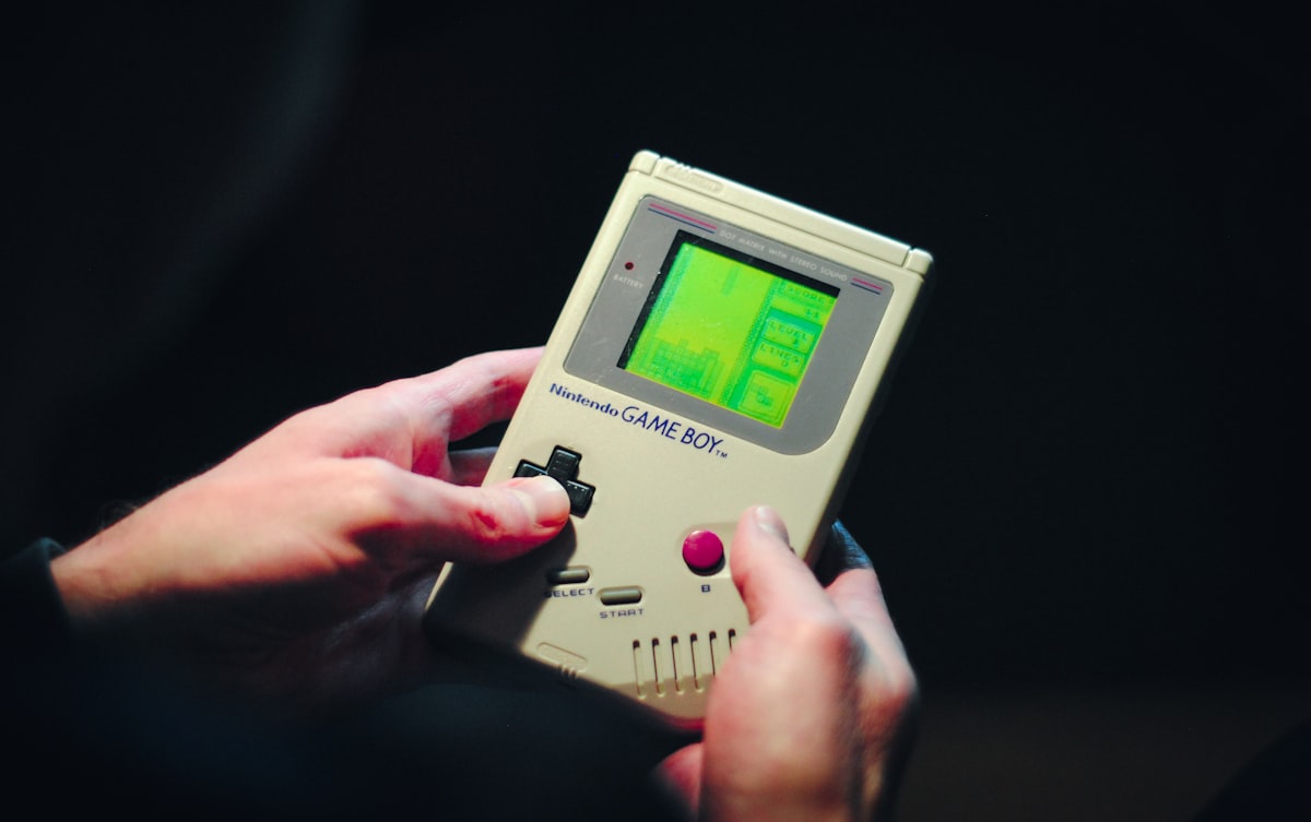 What was the name of the first handheld electronic game?