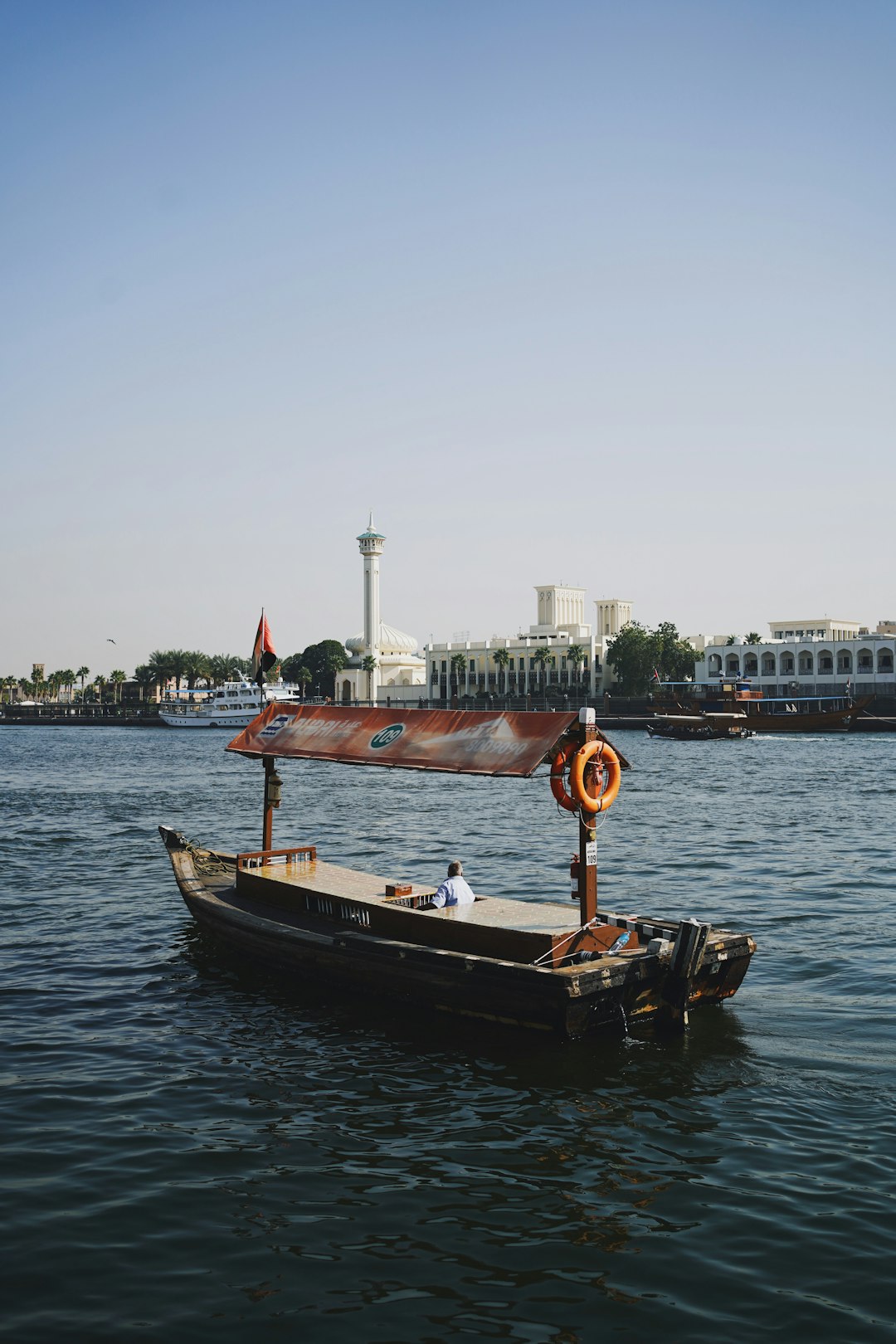 brown boat on body of water during daytime