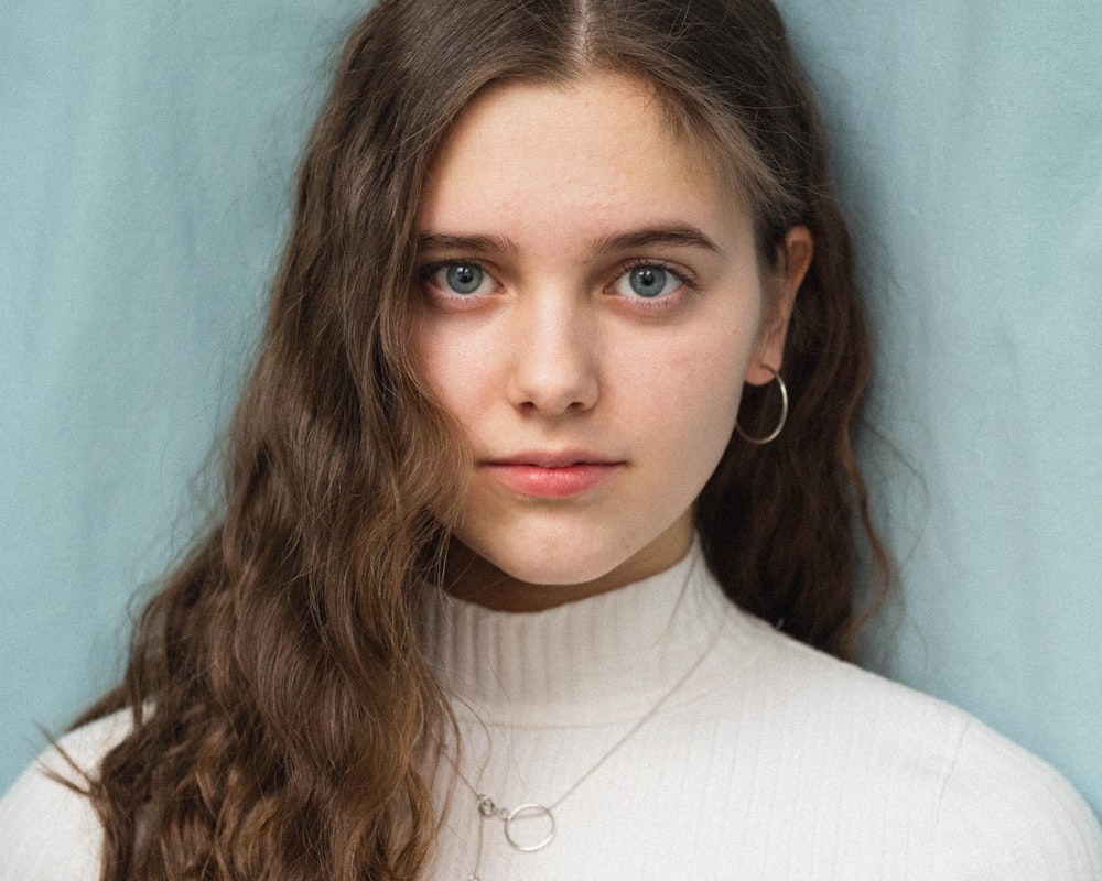 woman in white turtleneck shirt