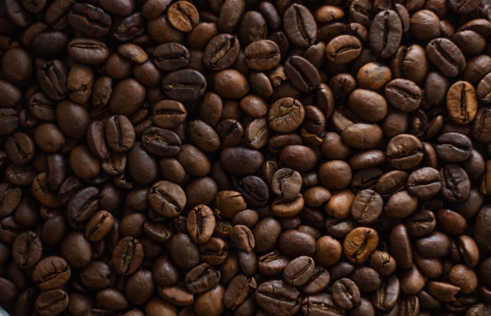 brown coffee beans on brown wooden table