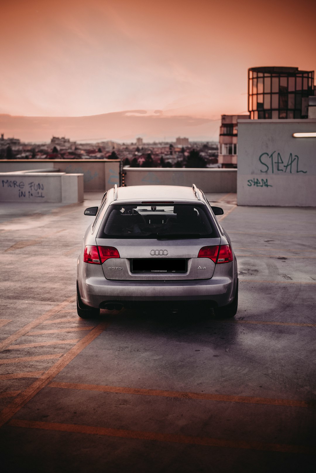 silver suv parked on parking lot during daytime