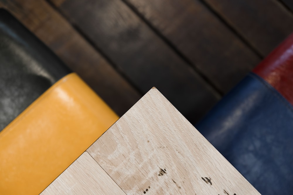 white wooden fence near blue and yellow textile