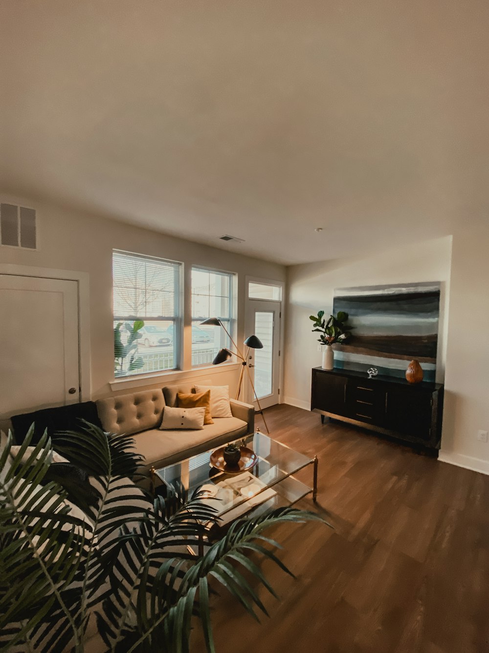 black flat screen tv on black wooden tv rack