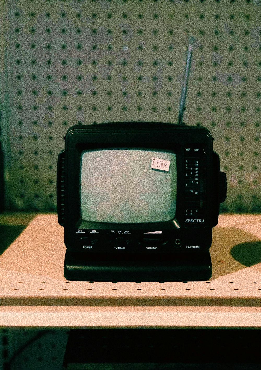 black crt tv on brown wooden table