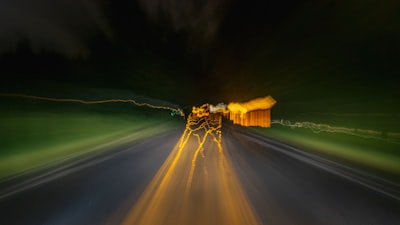 brown wooden house on green grass field during night time weary zoom background