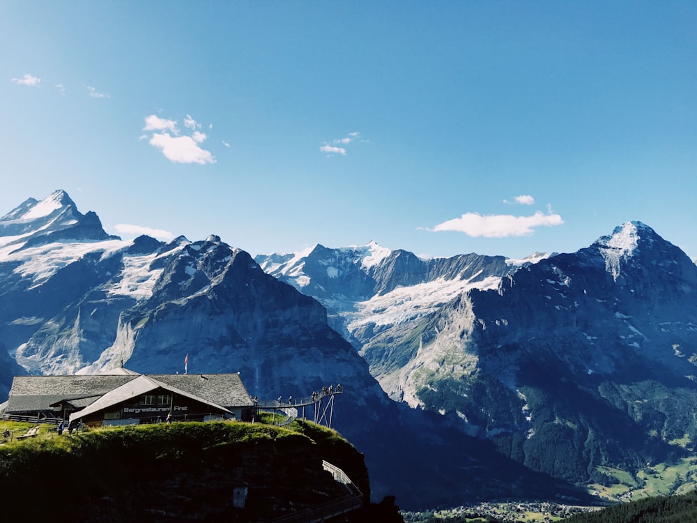 brown wooden house on top of mountain during daytime