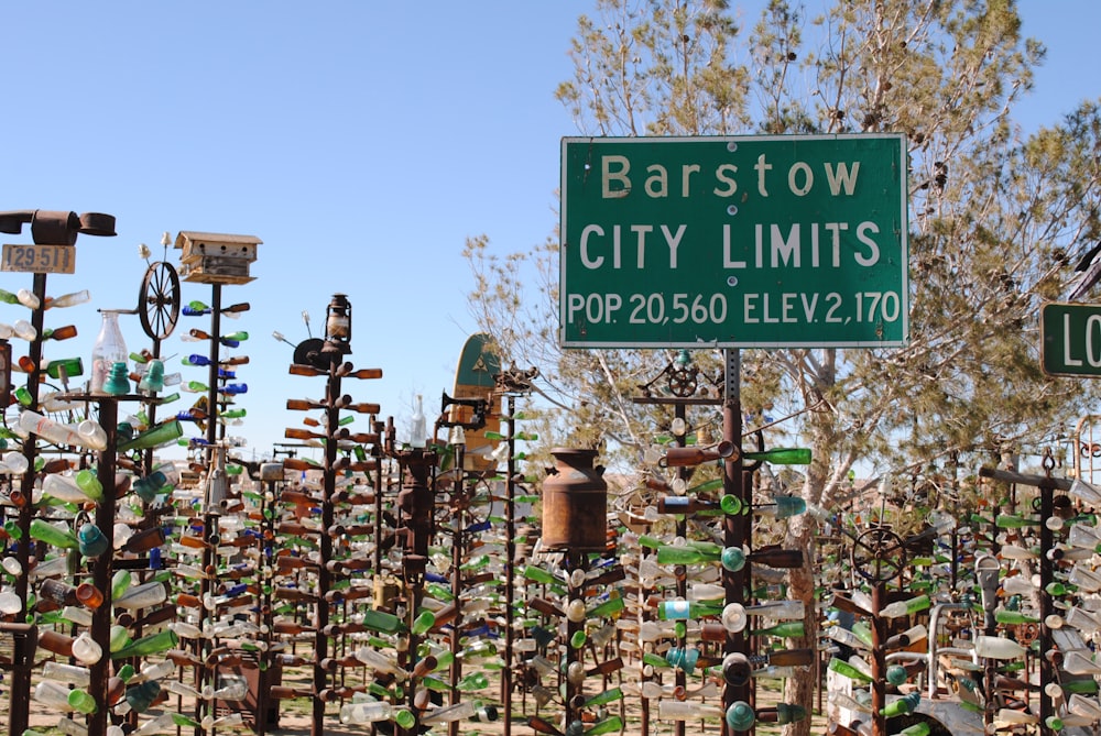 a lot of street signs that are in the grass