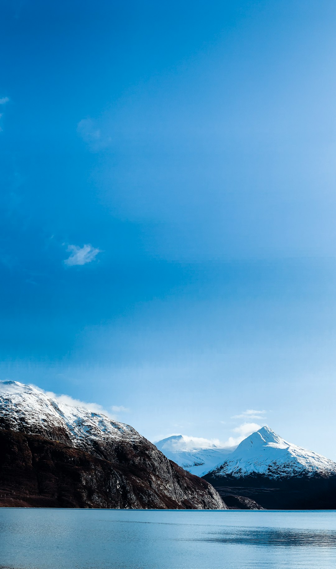 snow covered mountain under blue sky during daytime