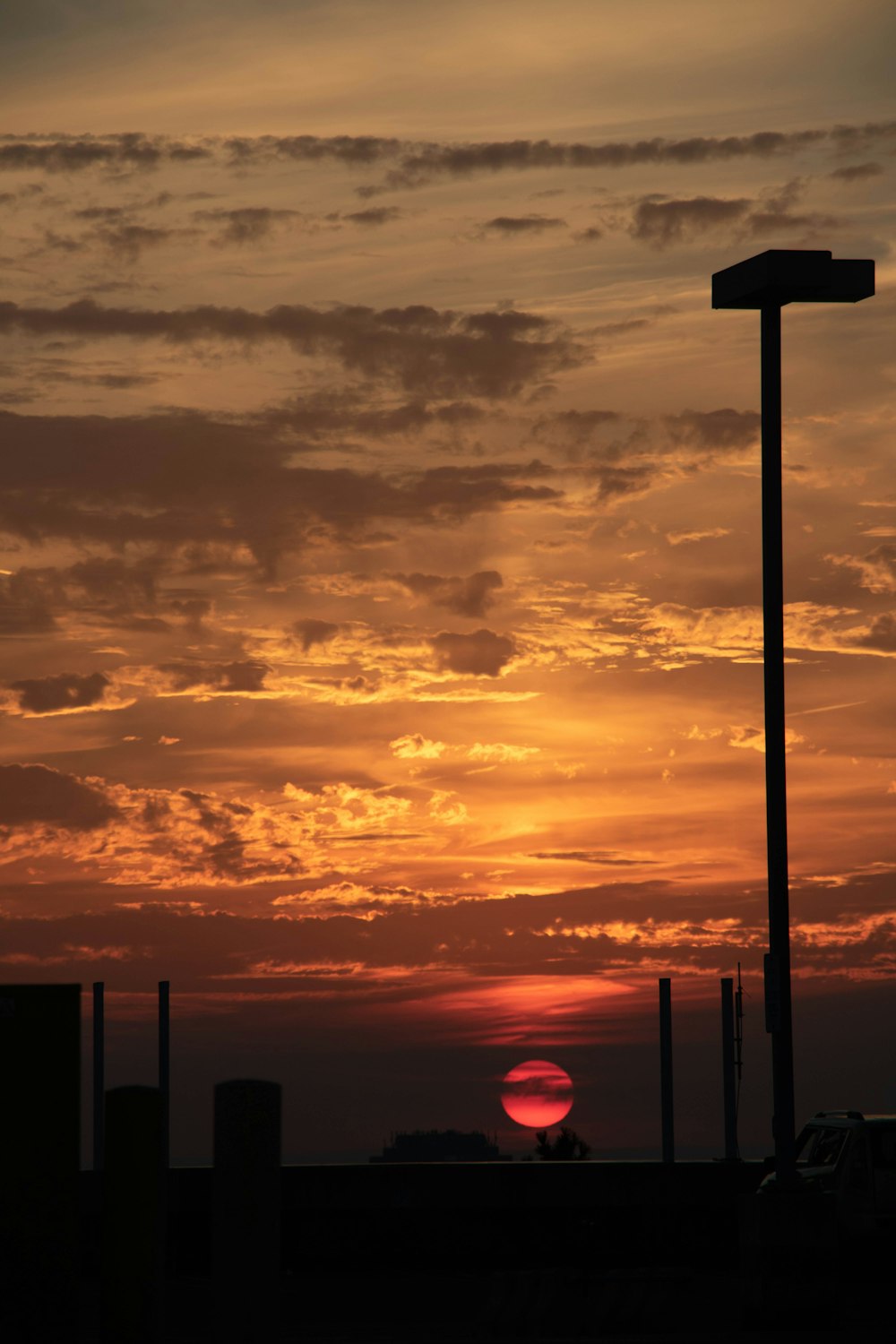 silhouette of street post during sunset