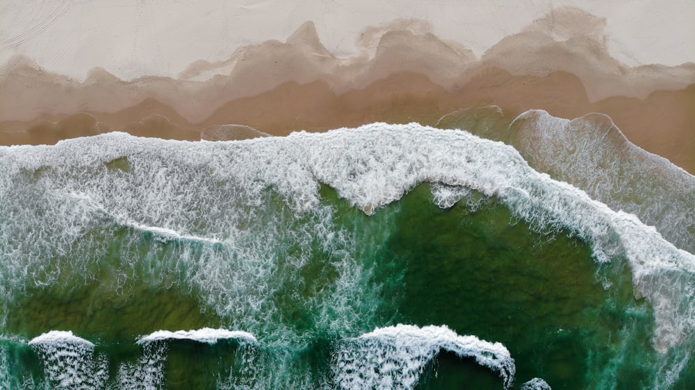 water waves on brown sand