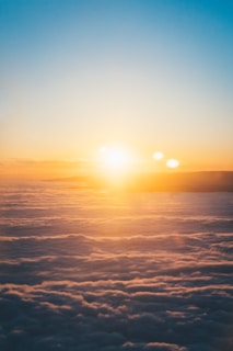 clouds and sun during sunset
