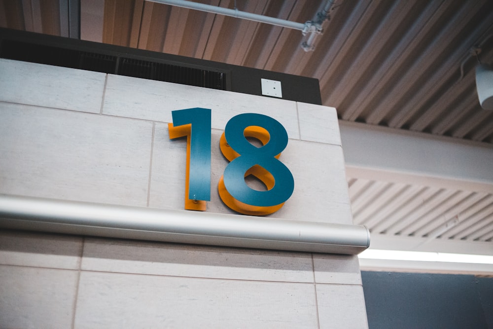 blue and yellow number 8 sign