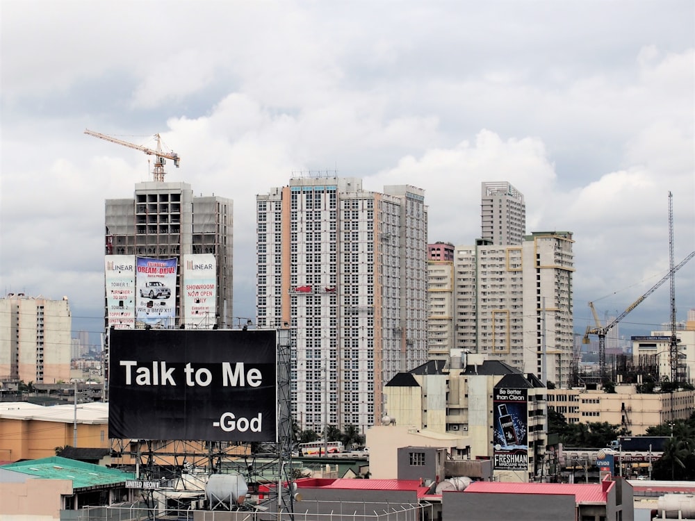 city skyline under white cloudy sky during daytime