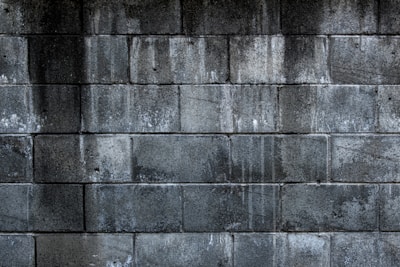 gray brick wall during daytime