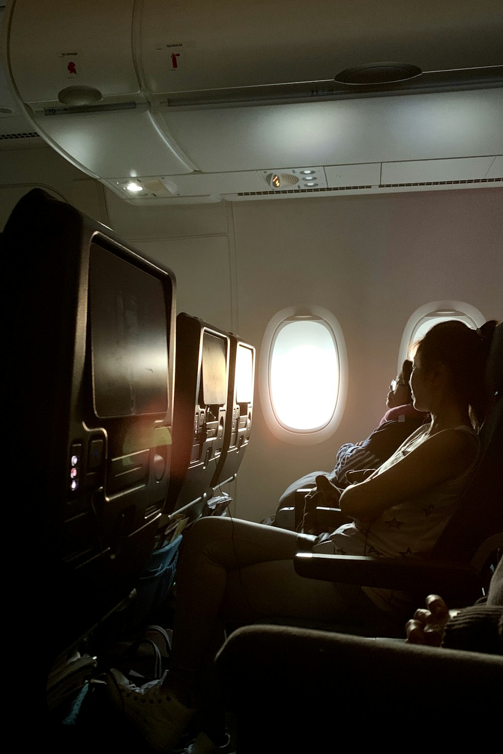 man in black jacket sitting on black chair