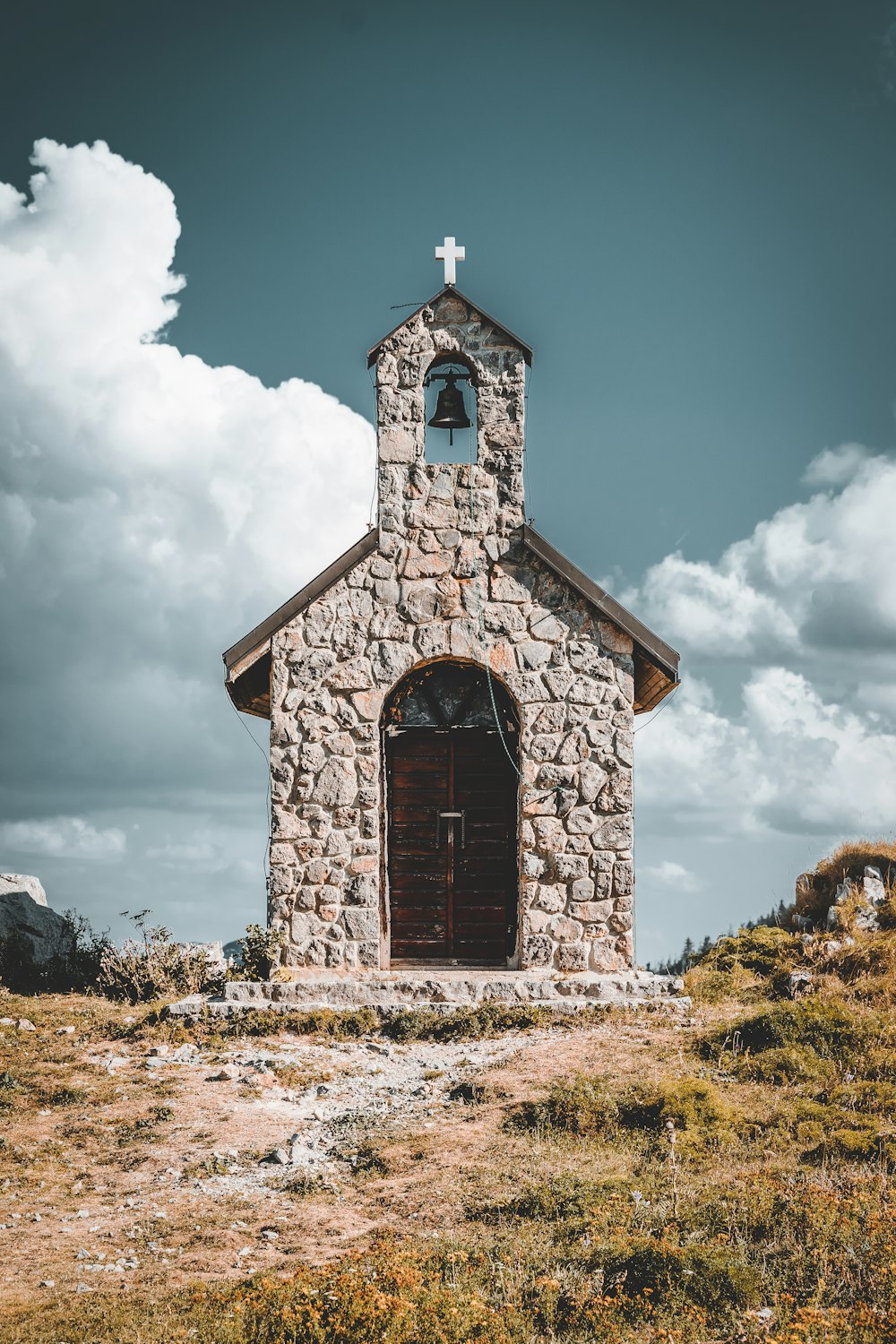 brown wooden church under blue sky