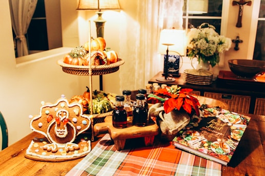 A festive table set with various pies and a mimosa bar for Thanksgiving.