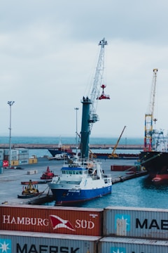 white and red ship on sea during daytime