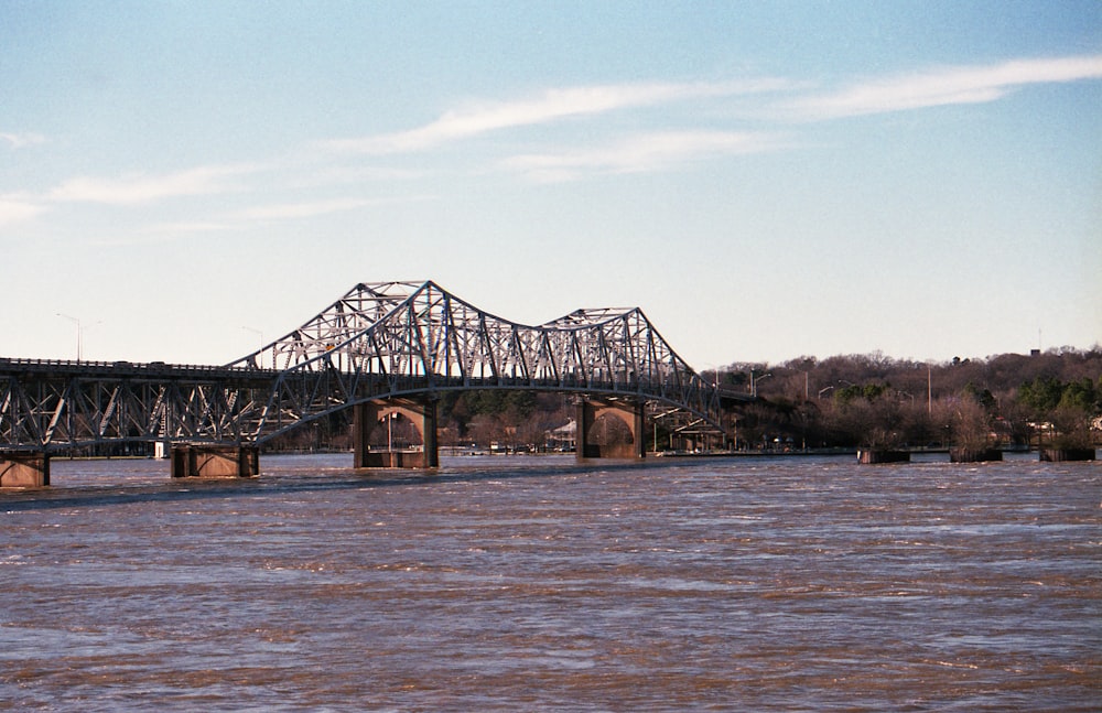 brown wooden bridge over the river