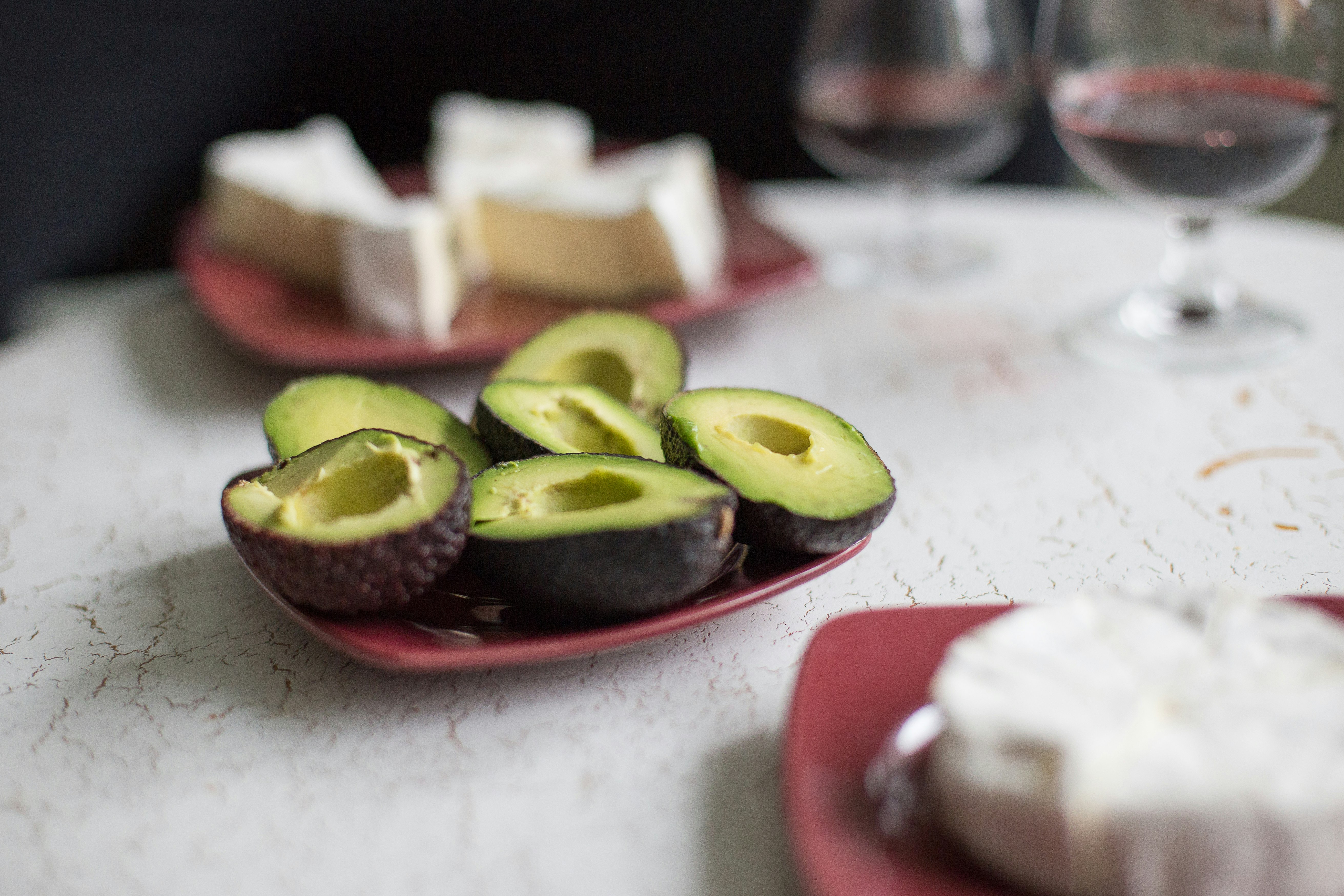 sliced avocado fruit on white ceramic plate