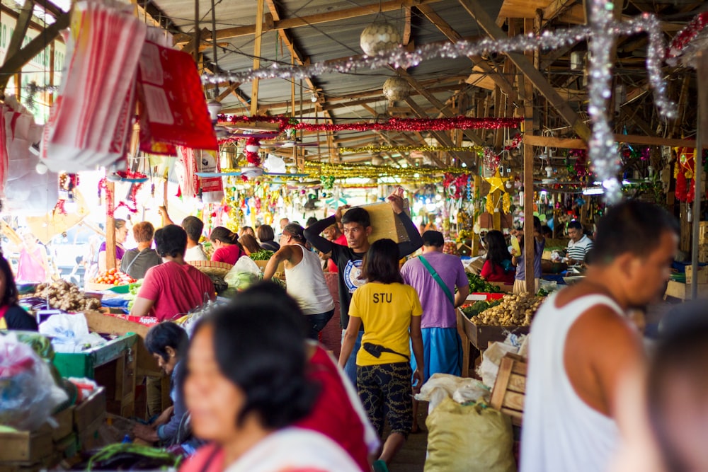 people in a market during daytime