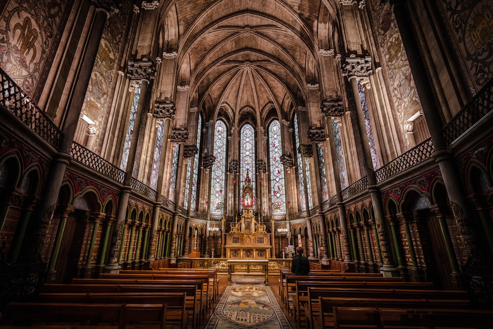 brown wooden bench inside cathedral