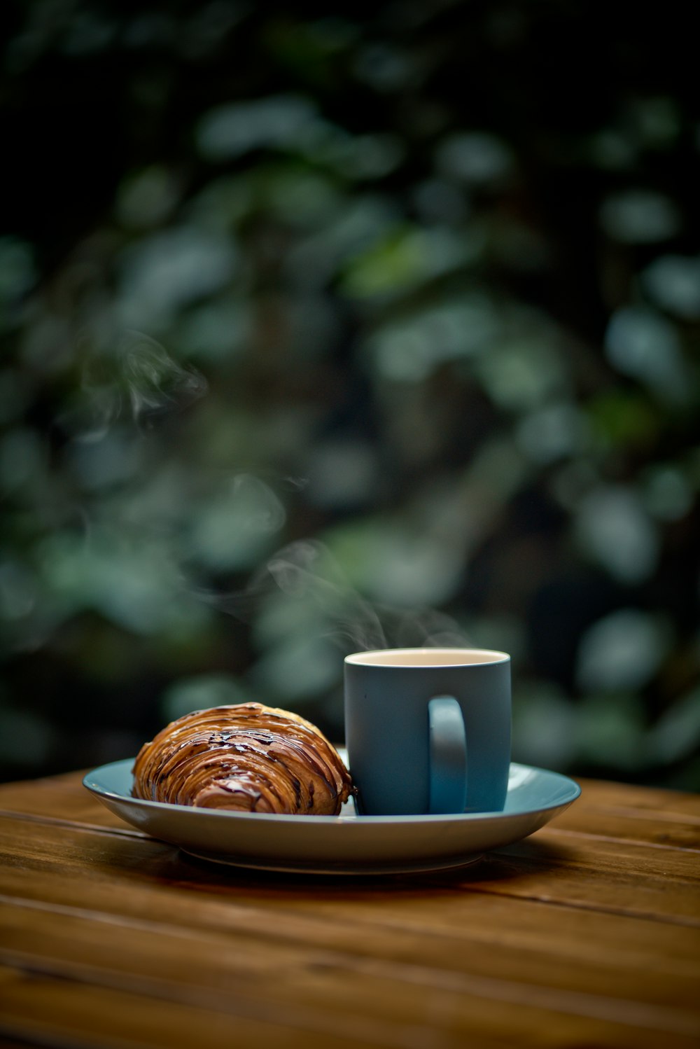 white ceramic mug on brown wooden table