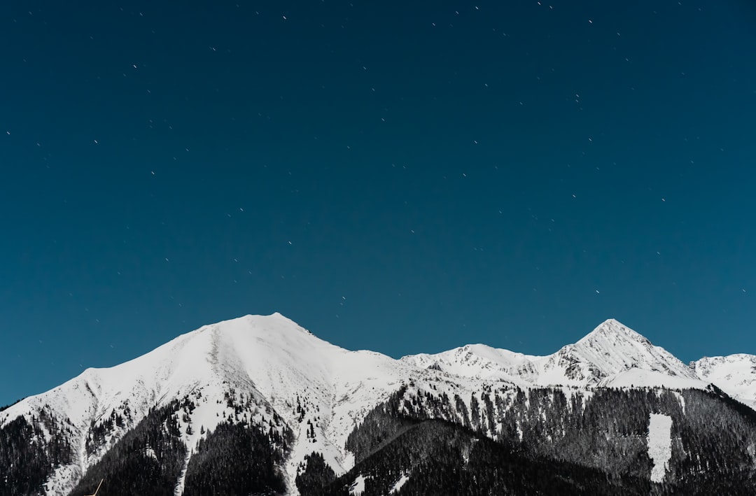 snow covered mountain under blue sky during daytime