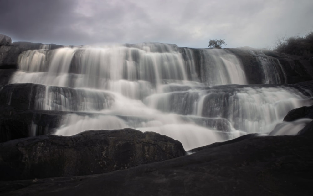 time lapse photography of waterfalls