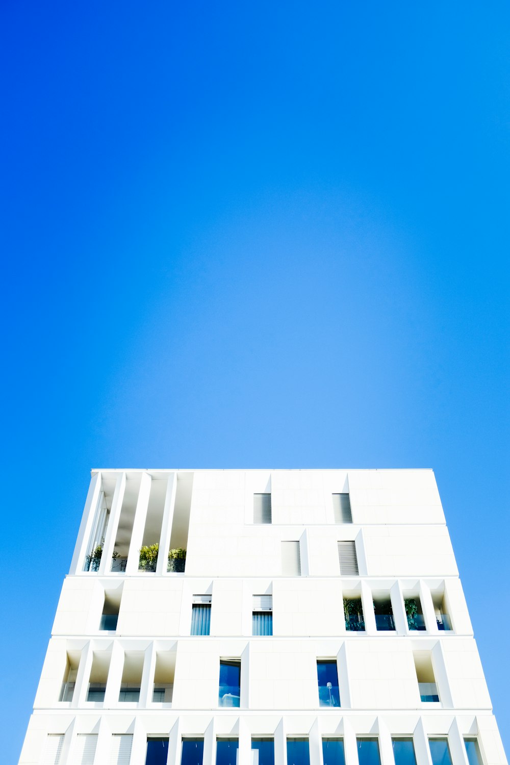 white concrete building under blue sky during daytime