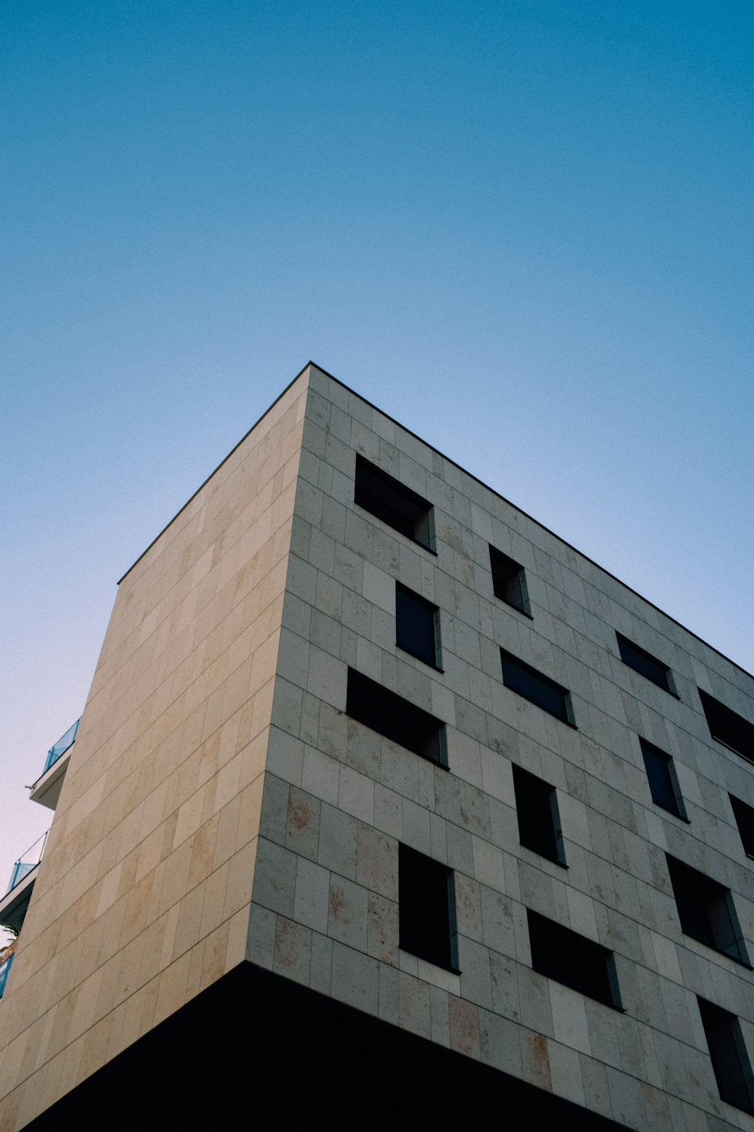 brown and white concrete building under blue sky during daytime