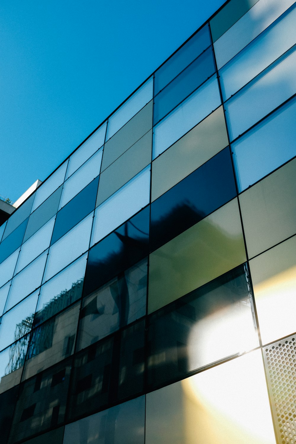 white and black glass walled building