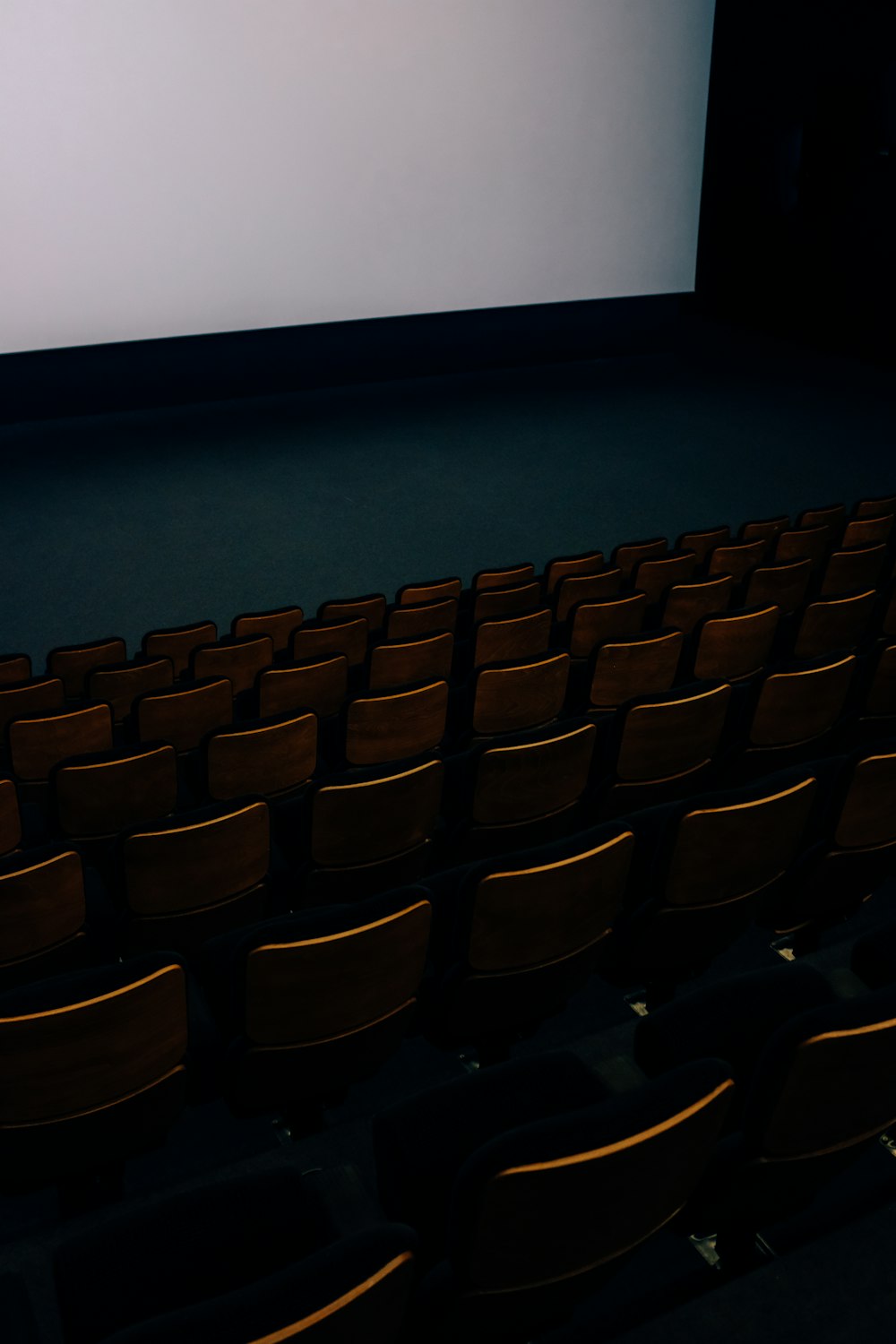 people sitting on brown chairs