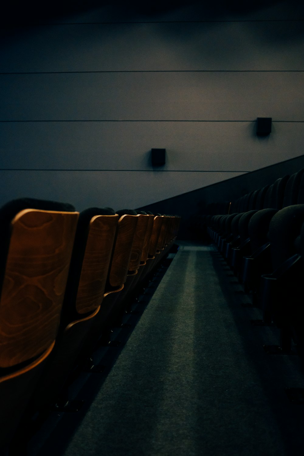 brown wooden chairs on gray concrete floor