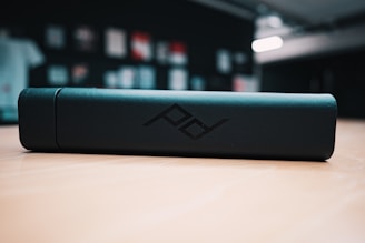 Various monochrome logos arranged neatly on a wooden table.