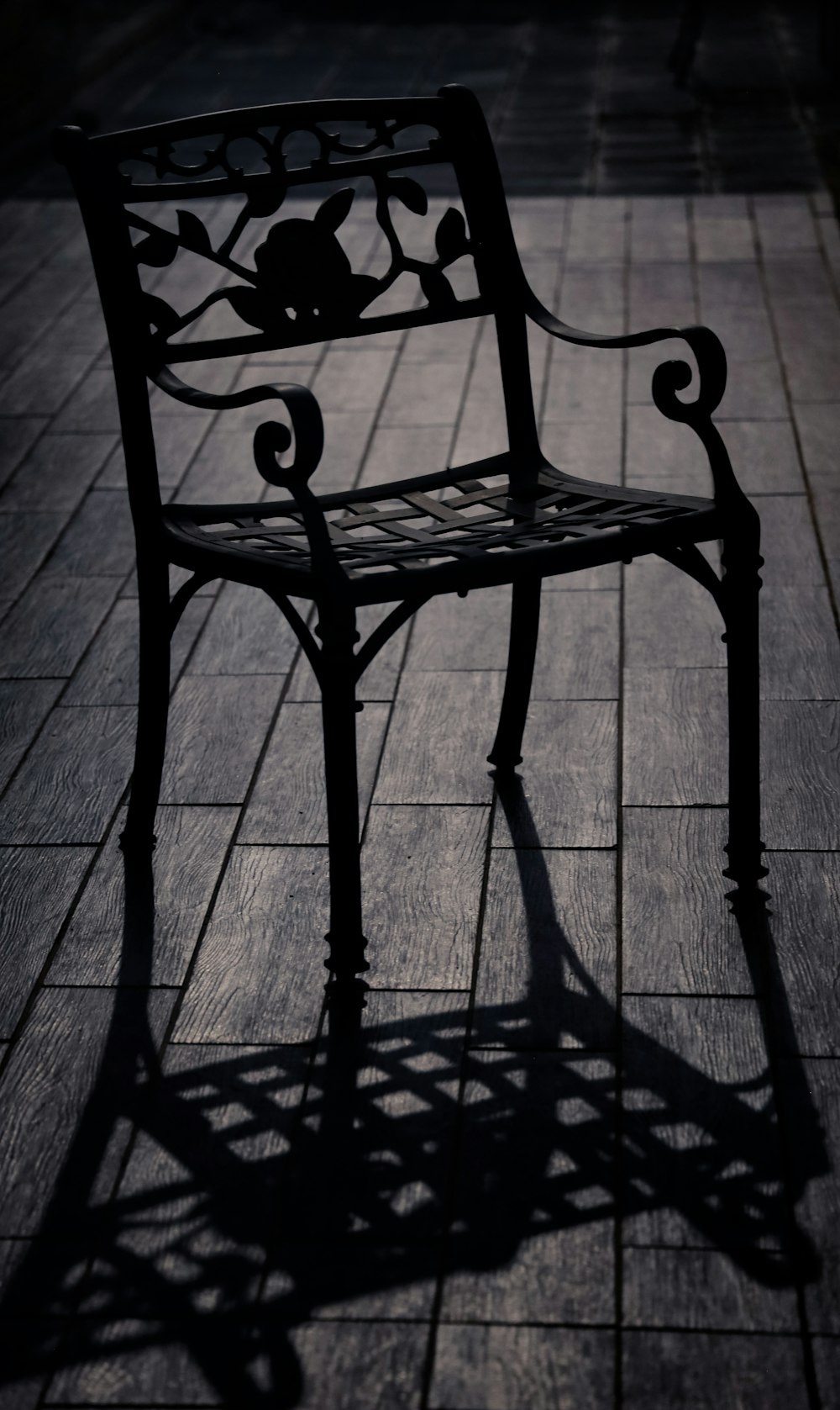 black metal bench on gray concrete floor