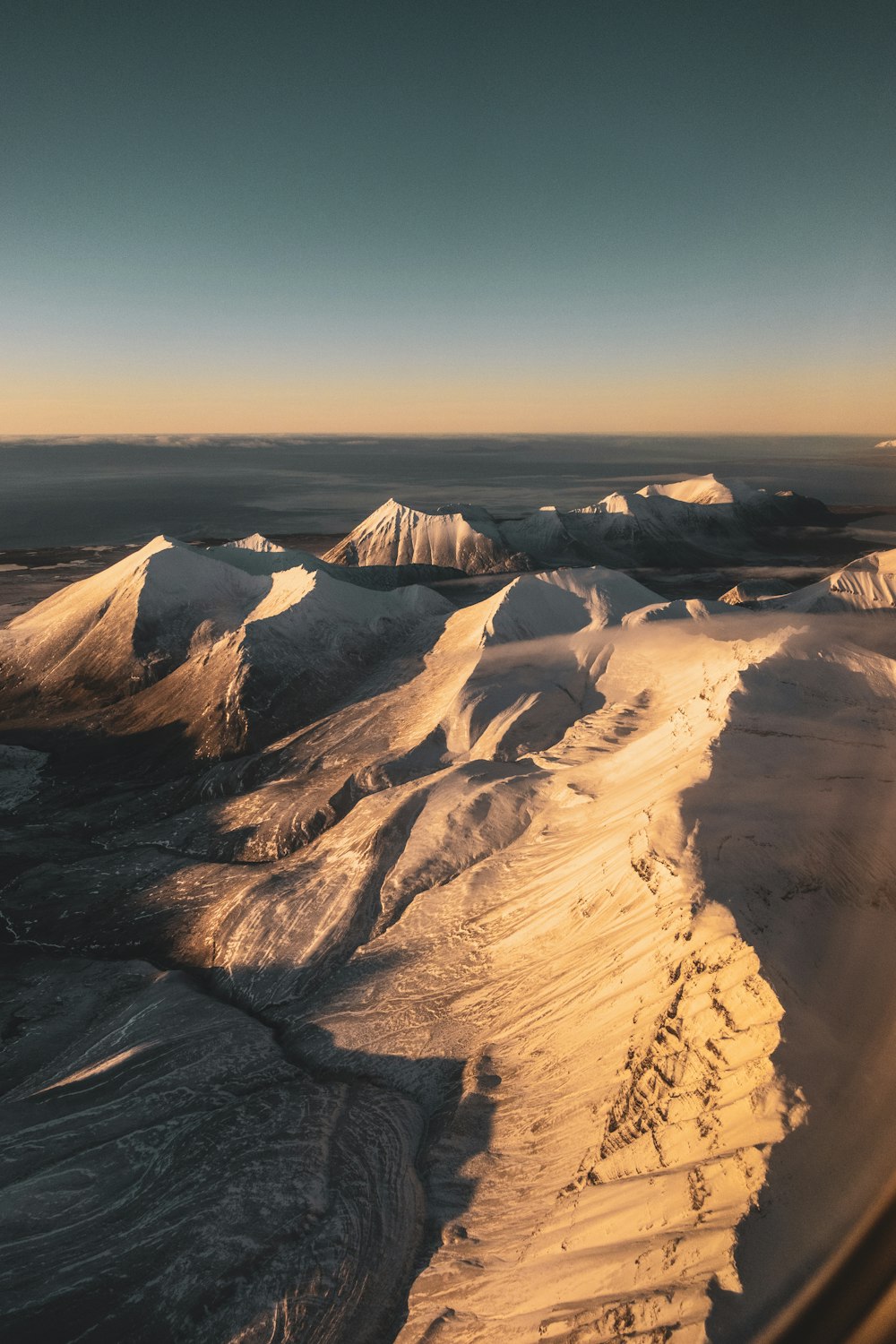 brown and white mountains under blue sky during daytime