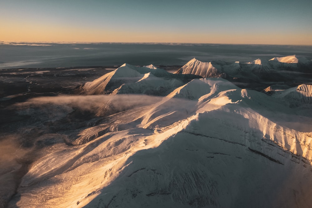 brown and white mountains under blue sky during daytime