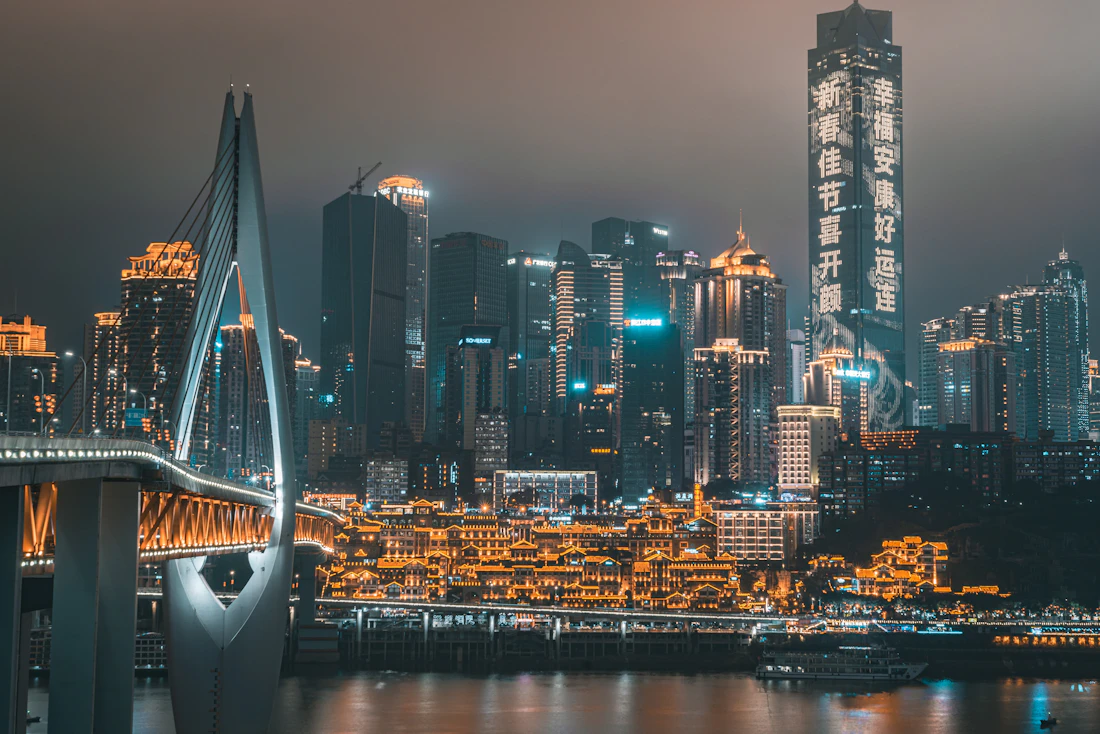 The Chongqing skyline lit up at night around the Jiefangbei district