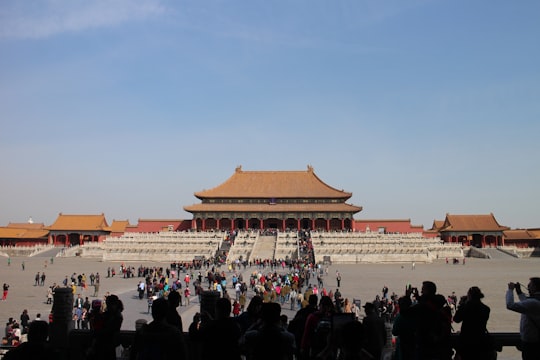 people walking on street during daytime in Forbidden City, Hall of Supreme Harmony China