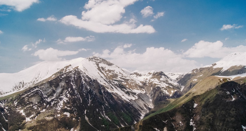 snow covered mountain under blue sky during daytime