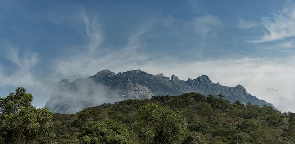 Green trees on mountain under white clouds during daytime — Kota Kinabalu, Malaysia