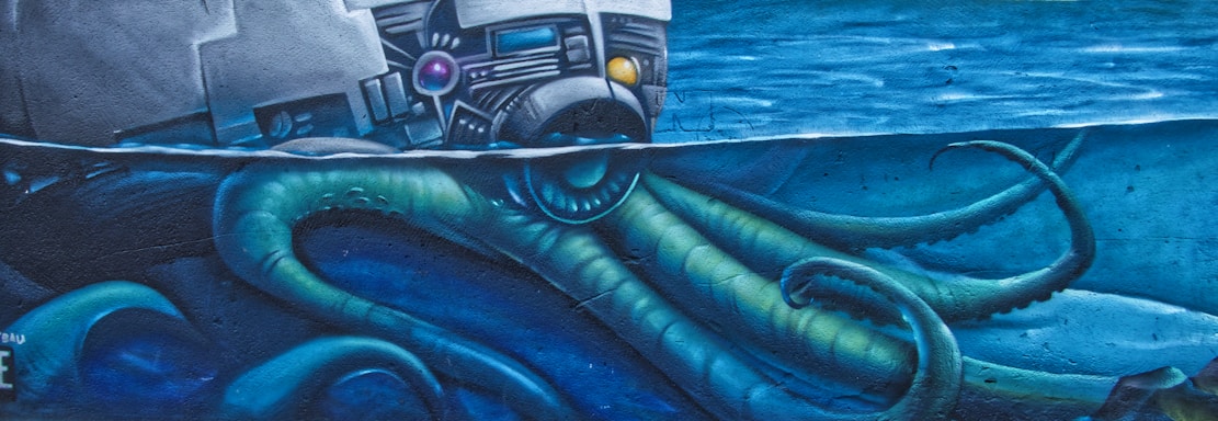 A mural featuring a large octopus underwater with its tentacles reaching up towards a spacecraft or satellite. The scene conveys a blend of science fiction and marine imagery, with vibrant blue and green colors dominating the composition.