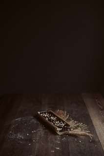 A rustic wooden table with a freshly baked tarte flambée steaming under soft natural light.