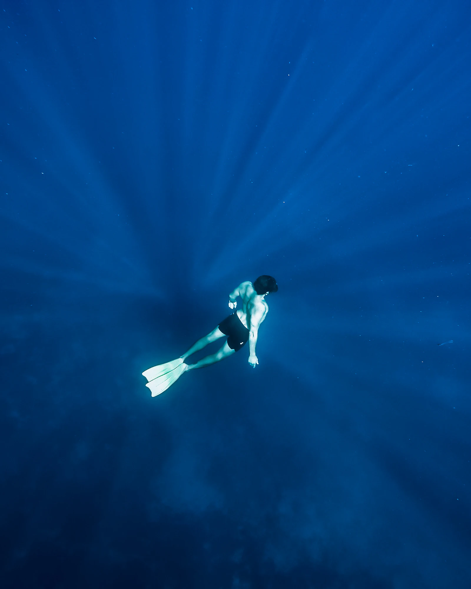 A man floating calmly on the surface of the ocean