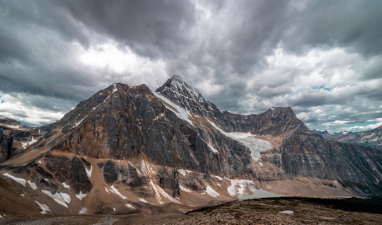 brown and white rocky mountain under cloudy sky during daytime in Jasper National Park Of Canada Canada
