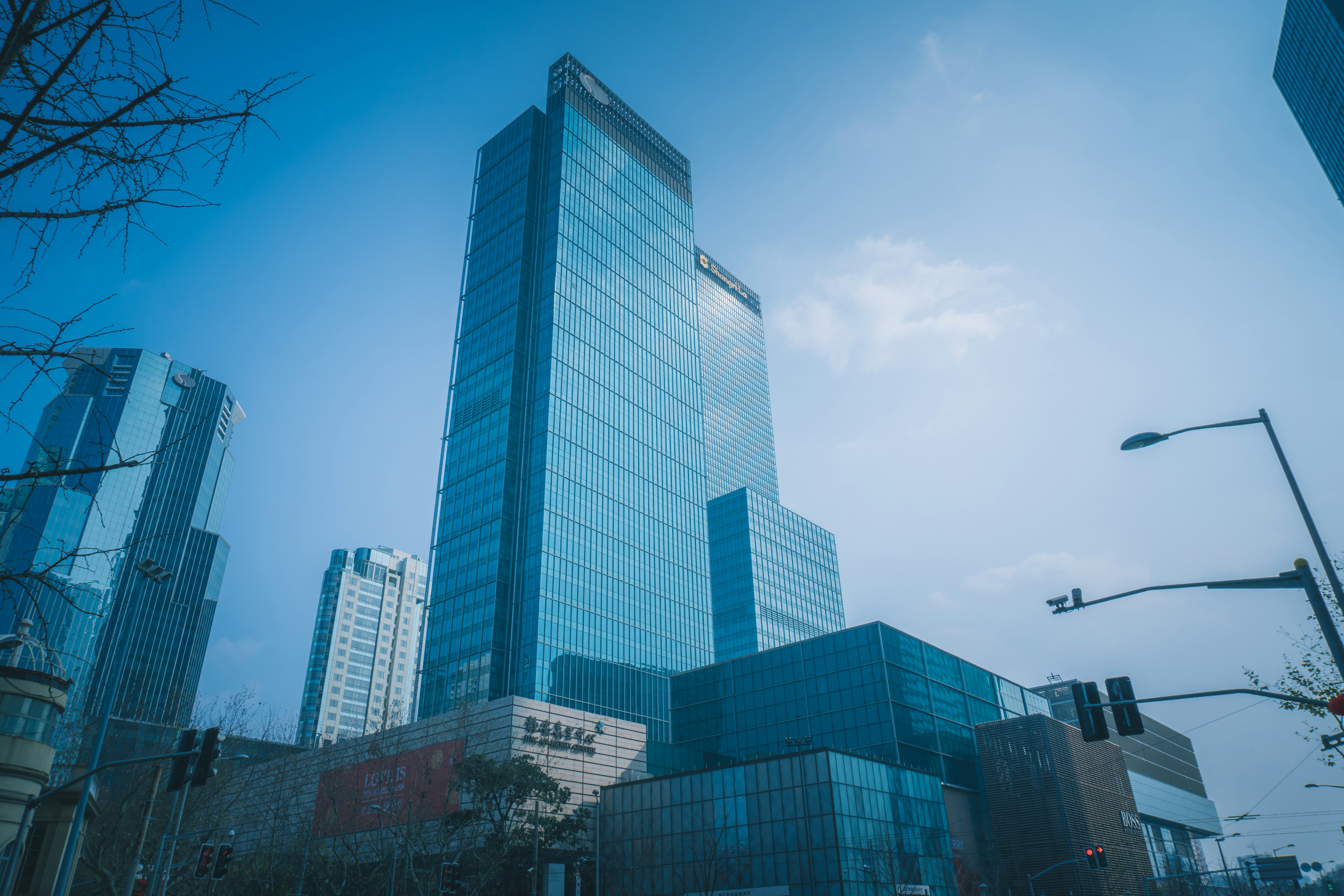 white and blue concrete building under blue sky during daytime
