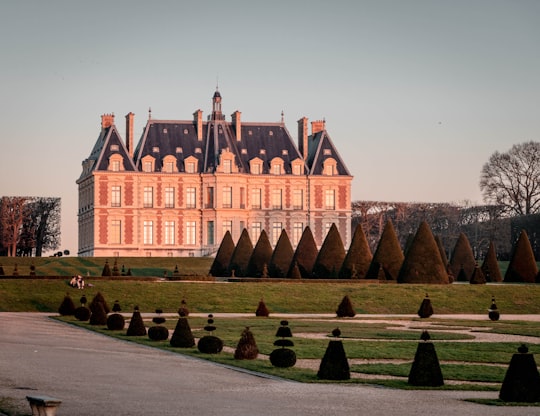 brown and white concrete building in Château de Sceaux France