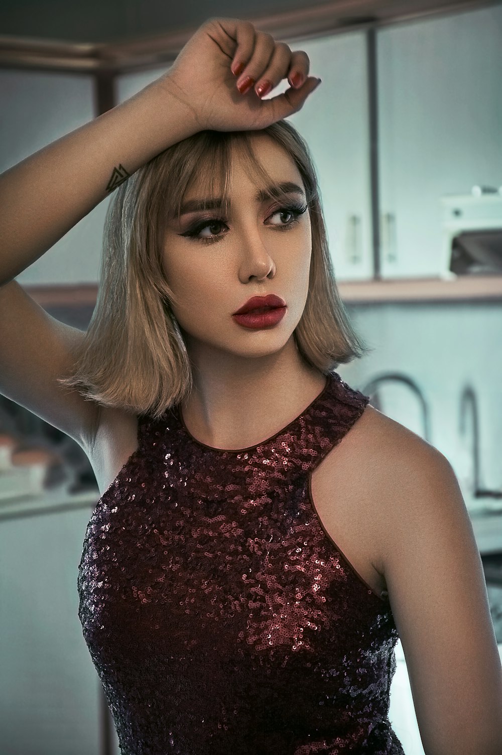 woman in red and black sleeveless top