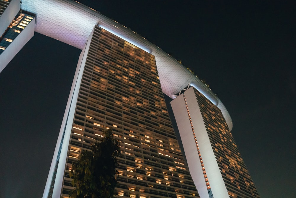 brown and white high rise building during night time